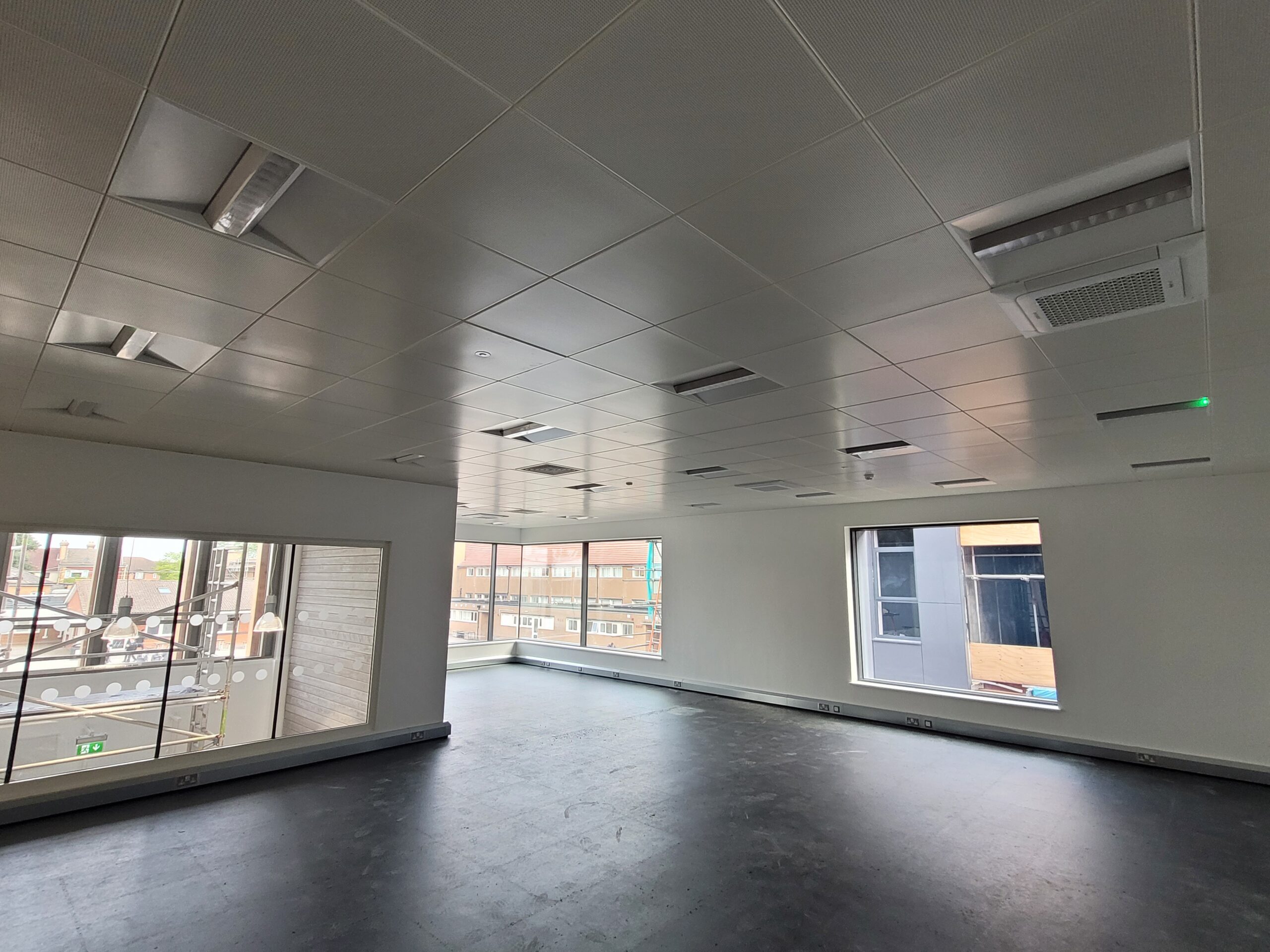 A new suspended ceiling inside a large office building.