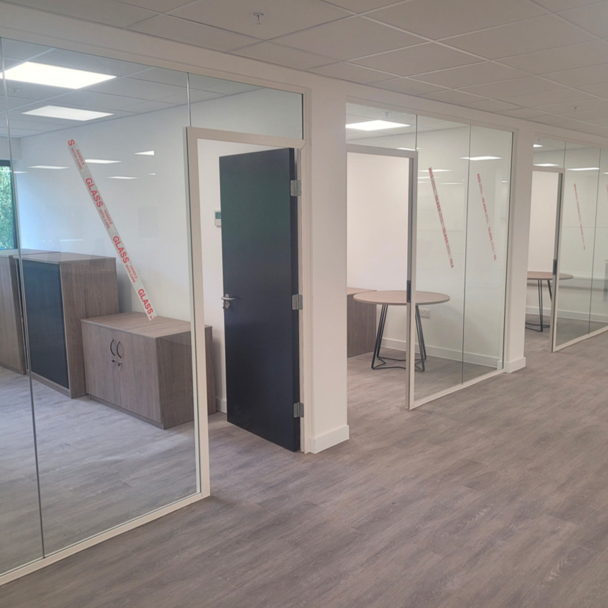 Glass office partition walls.